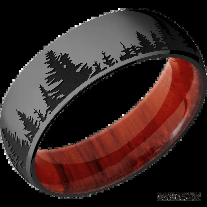 7 mm wide/Domed/Zirconium band with a laser carved Trees pattern also featuring a Padauk sleeve.