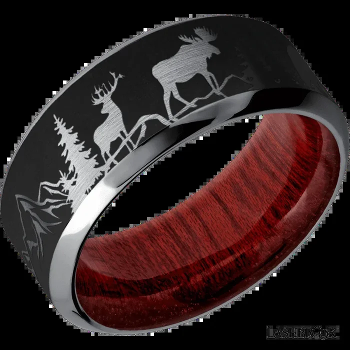 9 mm wide/High Bevel/Tantalum band with a laser carved Bear Moose Deer Mountain pattern also featuring a Blood Wood sleeve.