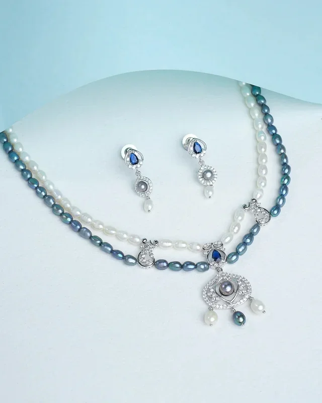 Dainty pearl necklace with matching earrings for an elegant finish