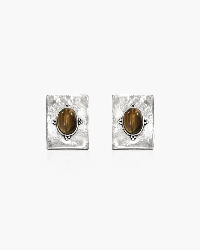 Les Boucles d’Oreilles Amulette Inexprimée